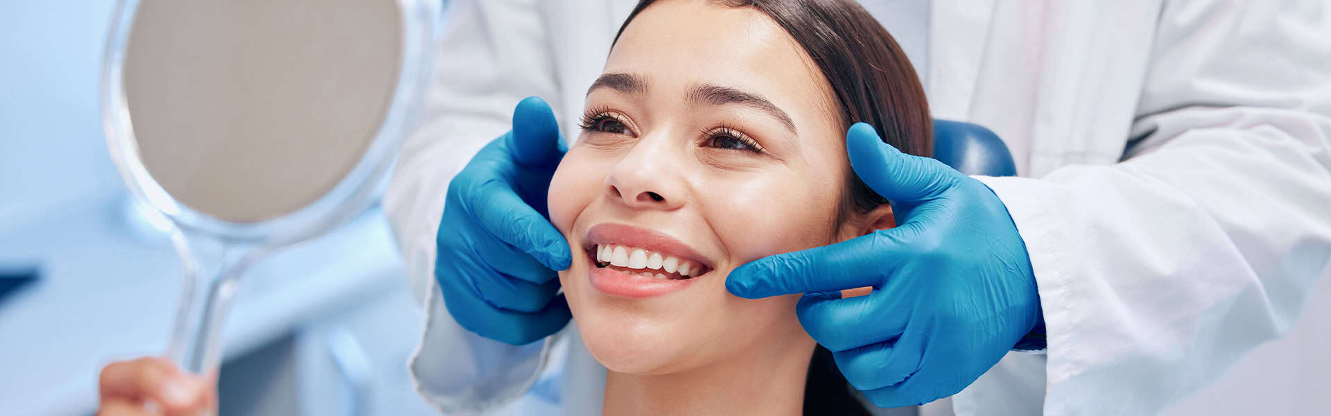 Happy Dental Patient Smiling In Mirror